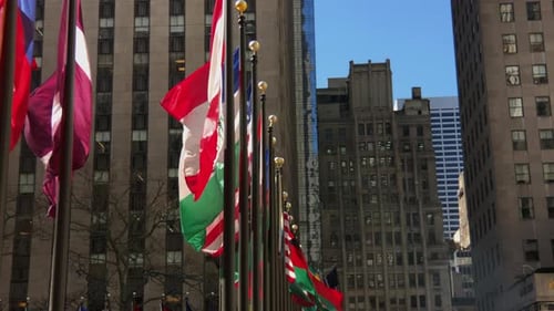 International Flags Waving in an Urban Cityscape