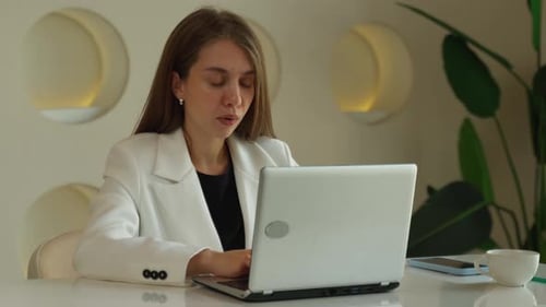Stressed Mature Business Woman Looking Worried Tired and Overwhelmed While Working with Laptop in