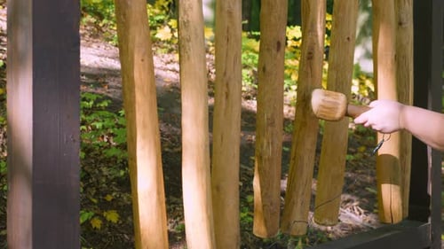 Musical instrument dendrofon. The sound is produced by hitting the sticks with a wooden mallet
