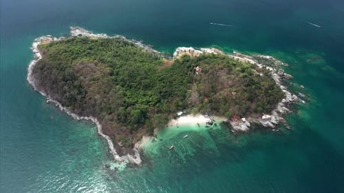 Aerial view of the heart shaped island in the tropical sea. Camera orbits