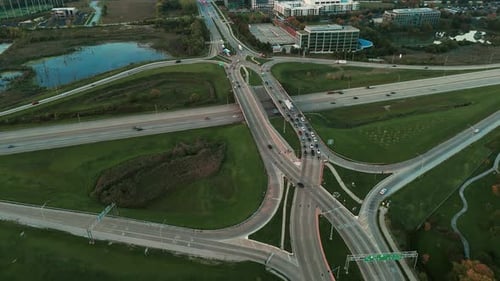 Drone Wide View Famous Road Intersection with Traffic on Multiple Flyovers in the Evening
