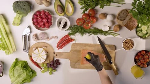 Overhead Food Preparation with Salmon and Fresh Ingredients