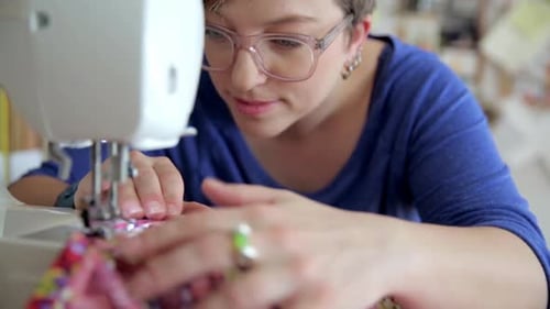 Close Up Focused Seamstress Using Sewing Machine 3539 Years