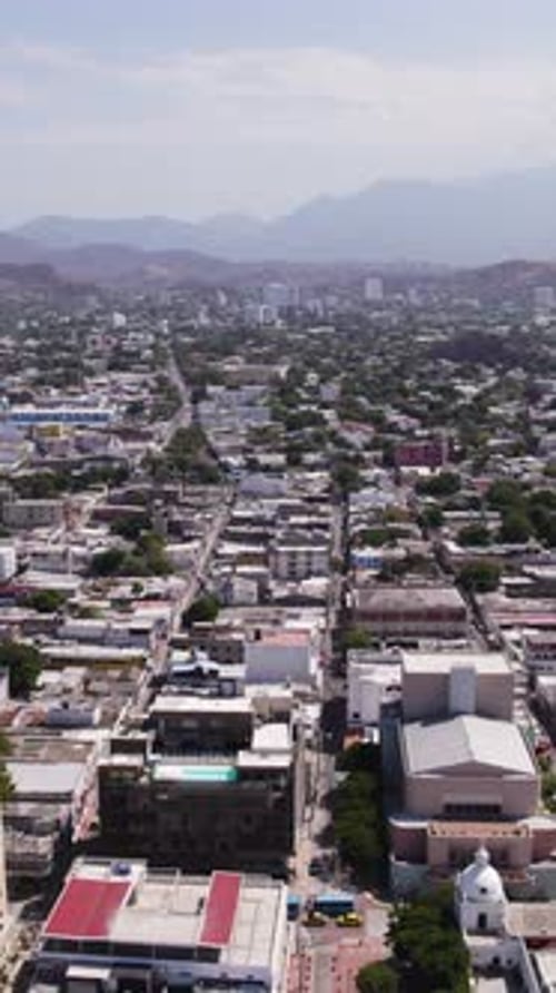 Aerial view of Santa Marta, Colombia, showing urban landscape. Vertical Video, Dolly Right