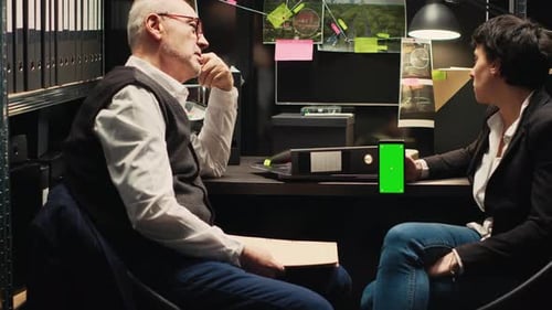 Intense Office Discussion with Mobile Phone