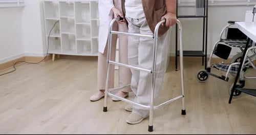 Assisted Walking with Walker in Medical Office
