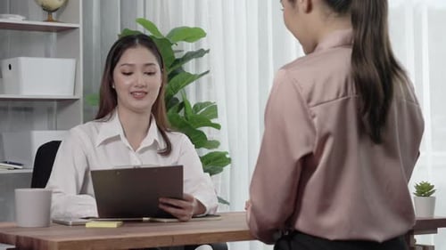 Young and enthusiastic candidate interview with HR manager in office.