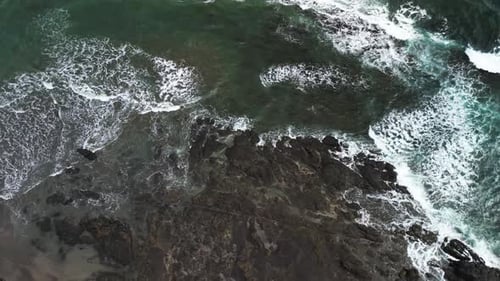 Sand And Rocks At The Blue Ocean