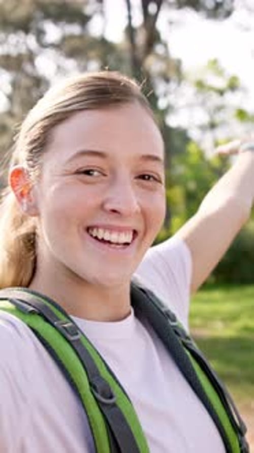 Happy woman, hiking or selfie with backpack in forest for travel, adventure or outdoor journey