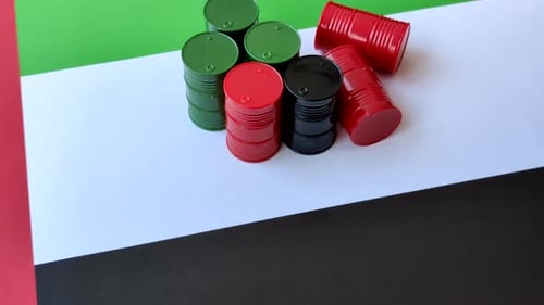 Metal barrels containing oil, gas, or chemicals, with a prohibition sign. Oil barrels