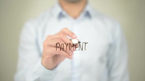 Man Writes Payment on Transparent Surface