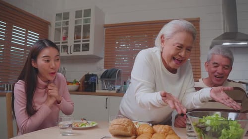 Family Meal and Conversation in a Kitchen
