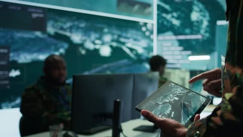 Military Officer Leads Cybersecurity Operations in a High Tech Operation Room