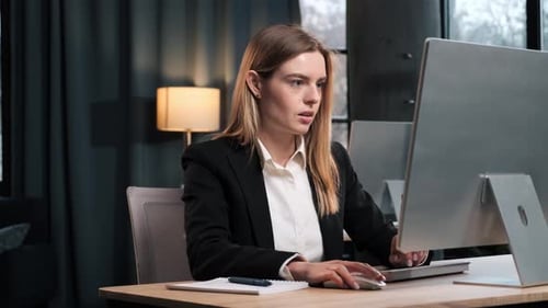 Professional Marketing Specialist Working on Laptop PC in Corporate Office