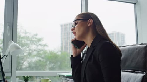 Confident Businesswoman Mobile Call in Office