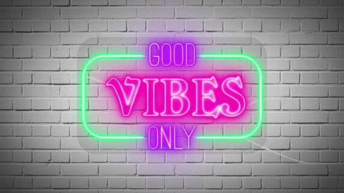 Neon 'Good Vibes Only' Sign on Brick Wall