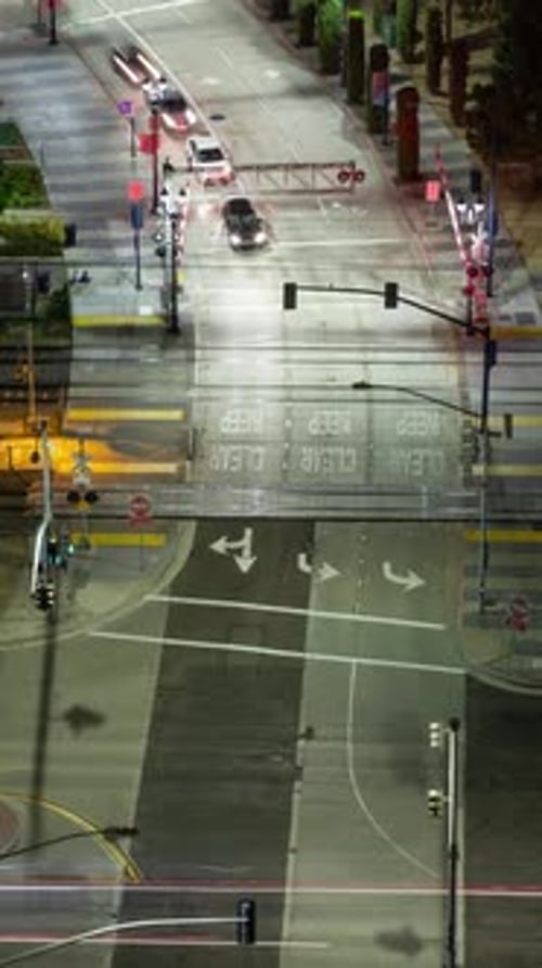 Vertical time lapse of a busy intersection in downtown San Diego at night