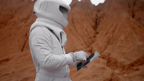 Astronaut Working with Digital Pad on the Mars Surface