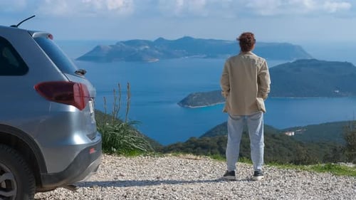 Woman Tourist Admiring Inspiring Seascape View From Mountain Road