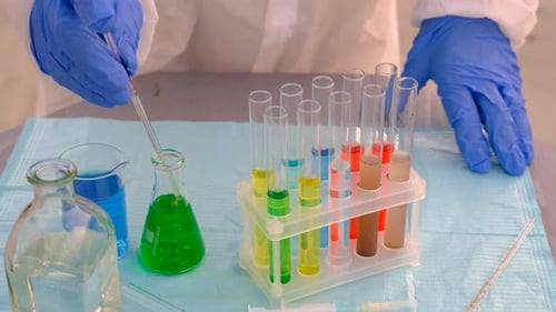 Colorful Liquids Transferred to Test Tubes in Lab