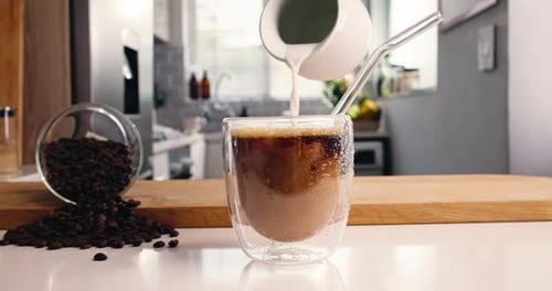 Milk Added to Coffee with Coffee Beans