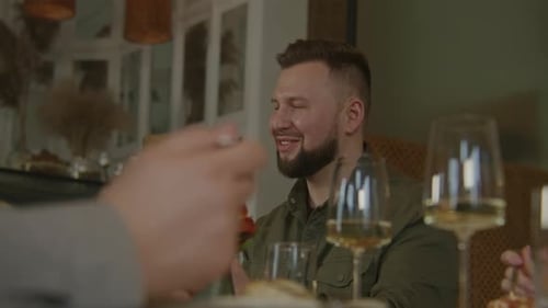 Happy Man in Modern Cafe with Friends