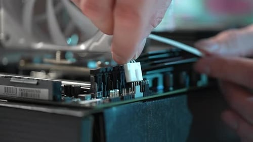 Extreme Closeup of Unrecognizable Man Plugging PC CPU Air Cooling System Radiator Power Cable Into