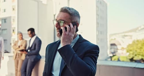 Professional Businessman Talking on Phone Outdoors