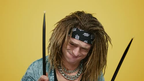 Closeup of Emotional Musician Playing Drums in Studio. Portrait of Positive Man