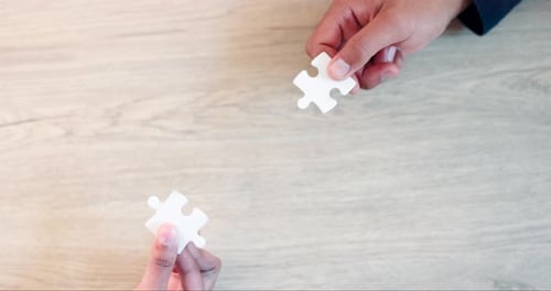 Business, hands or top view of puzzle for problem solving ideas with planning
