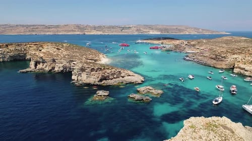Aerial view flying over yachts in Blue Lagoon, Malta