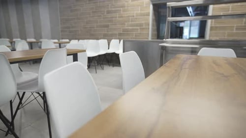 Empty Cafeteria Tables and Chairs