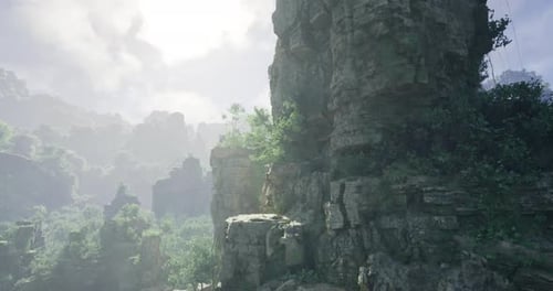 Beautiful Rocky Landscape with Mist and Greenery During Daytime Hours