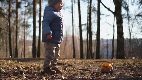 Happy Baby Child Outdoor Little Toddler Boy with Toy Car Having Fun on Walk in Park Baby Son Smiling