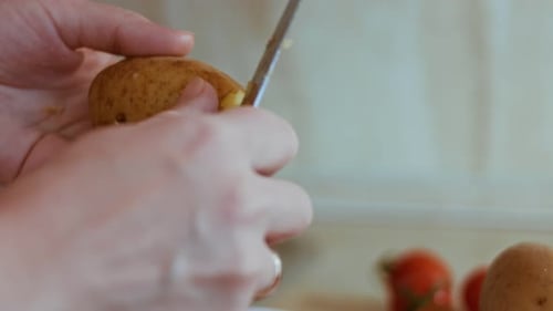 Peeling Potatoes for Olive Salad Russian Salad