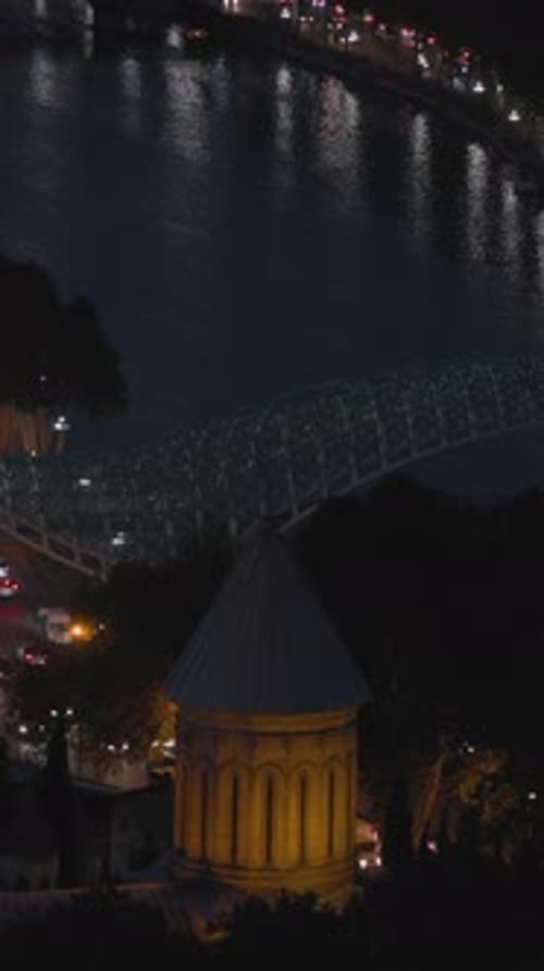 Tbilisi Georgia Night View Of Bridge Of Peace Over Kura Mtkvari River In Evenvertical g