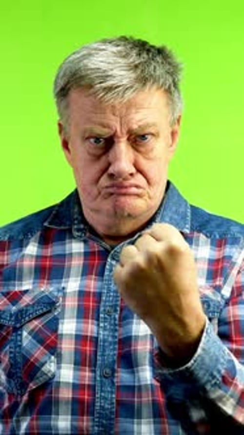 Man Makes Angry Fist on Green Screen Background