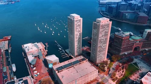Approaching the Charles River in the Massachusetts Bay. Two similar buildings are on the waterfront.