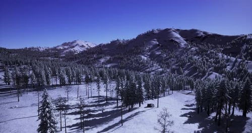 Snowy Landscape Showcases Tranquil Beauty of Winter at Dawn in Remote Mountains