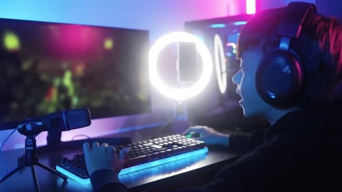 Teen Gamer with Computer Setup and Ring Light