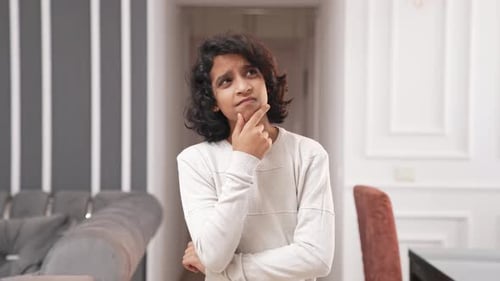 Intelligent Indian kid thinking hard