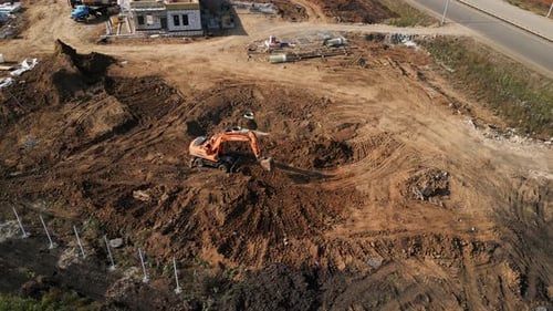 Excavator Works on Construction Site Aerial View