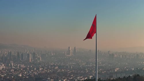Turkish Flag Waves Majestically From a Towering Flagpole Overlooking Istanbul