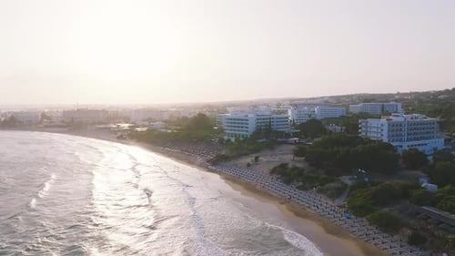 Aerial View of Ayia Napa Beachfront and Resort Town at Sunset