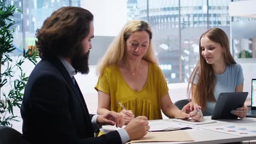 Business Meeting with Signing in Modern Office