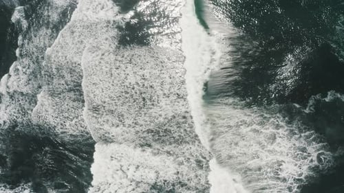 Top Down View Of Foamy Ocean Waves At El Paredon Beach In Guatemala - aerial drone shot