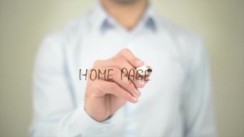 Adult Writes on Transparent Surface With Marker