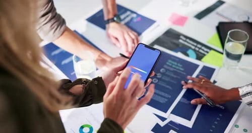 Business Team Working with Smartphone at Table