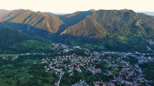 View From Rock to Town of Smolyan with Meadows for Cattle Walking and Houses Between Mountain Range
