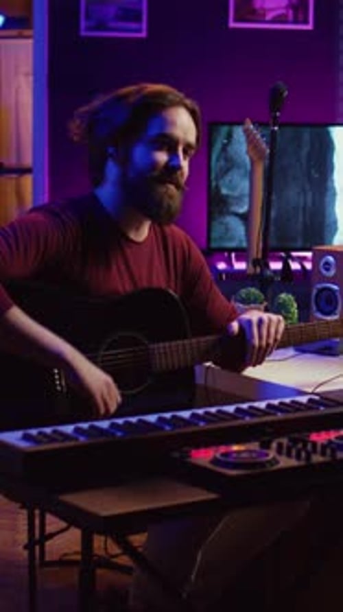Musician Playing Guitar in Colorful Home Music Studio